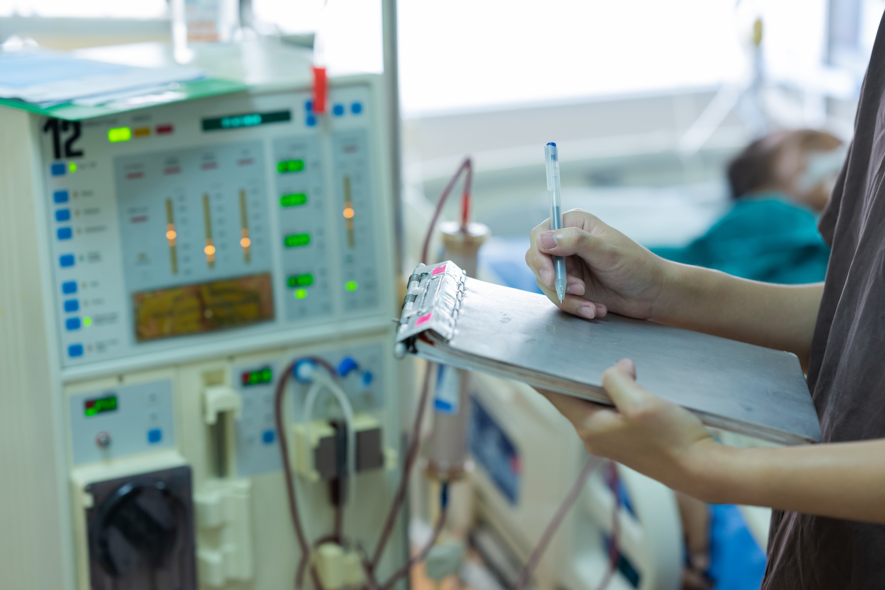 The specialist are checking continuous renal replacement therapy equipment and injection pump and hemodialysis machine.