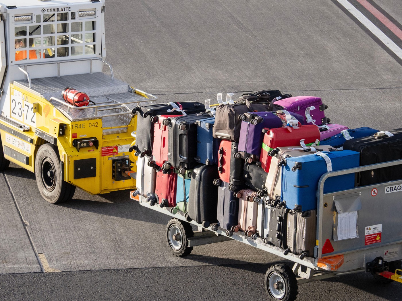 Unloading baggage from a plane at Funchal airport on Madeira.