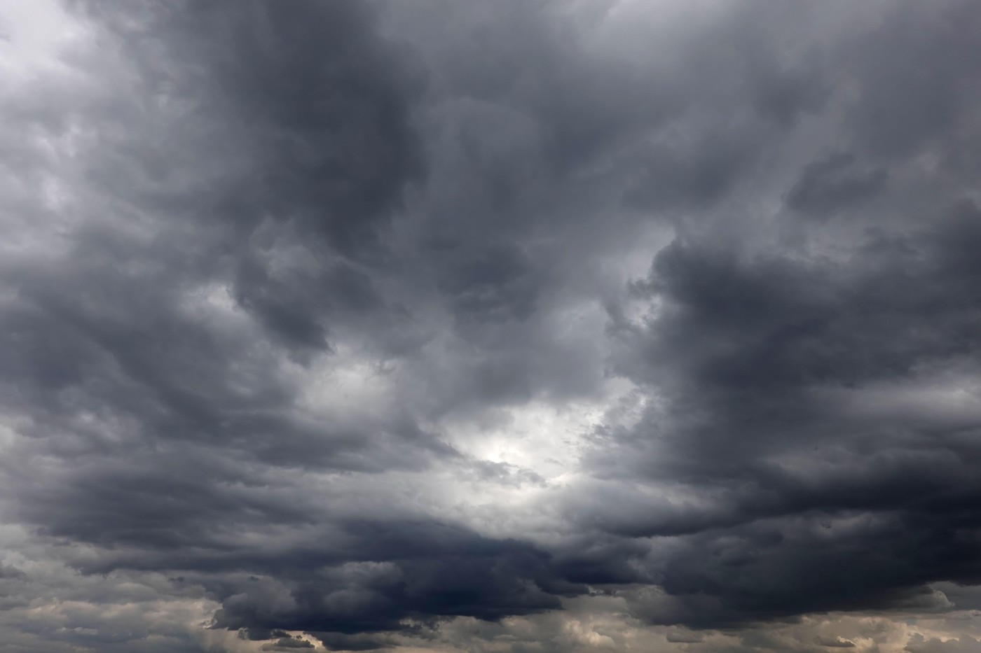 Overcast storm weather with dramatic heavy gray rainy cumulus clouds all over the sky