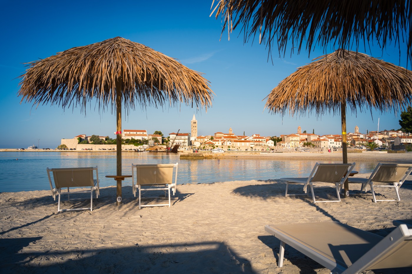 Urban beach near the old town of Rab,  the Adriatic Sea in Croatia,Image: 898156397, License: Royalty-free, Restrictions: , Model Release: no