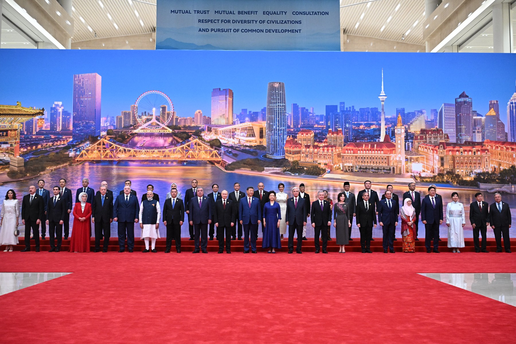 Russia's President Vladimir Putin, Chinese President Xi Jinping, his wife Peng Liyuan and foreign leaders pose during a family photo of the Shanghai Cooperation Organization (SCO) Summit in Tianjin on August 31, 2025.,Image: 1032922277,
