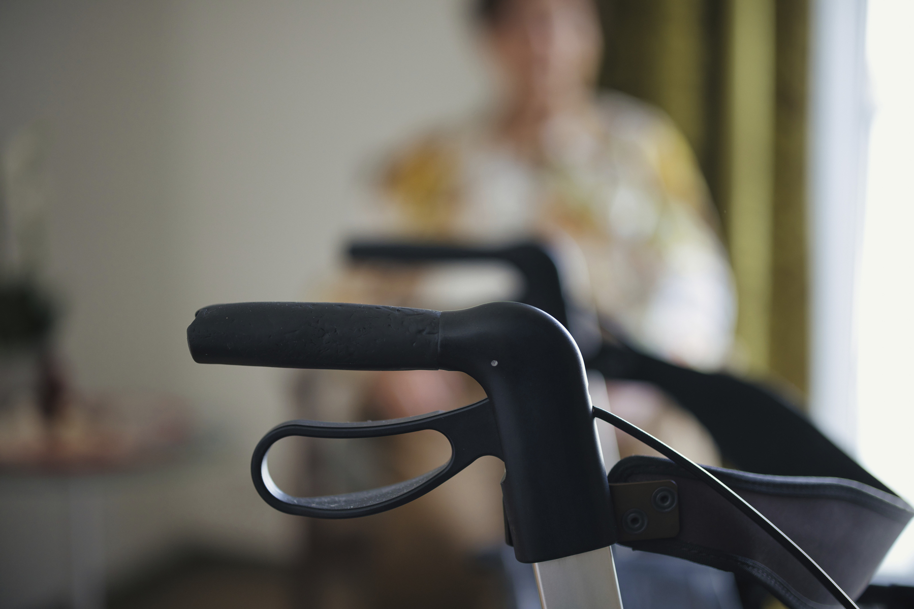 Close-up of a rollator with blurred background of a woman in her room in a retirement home, Cologne, North Rhine-Westphalia, Germany,Image: 1030497065, License: Royalty-free, Restrictions: , Model Release: yes