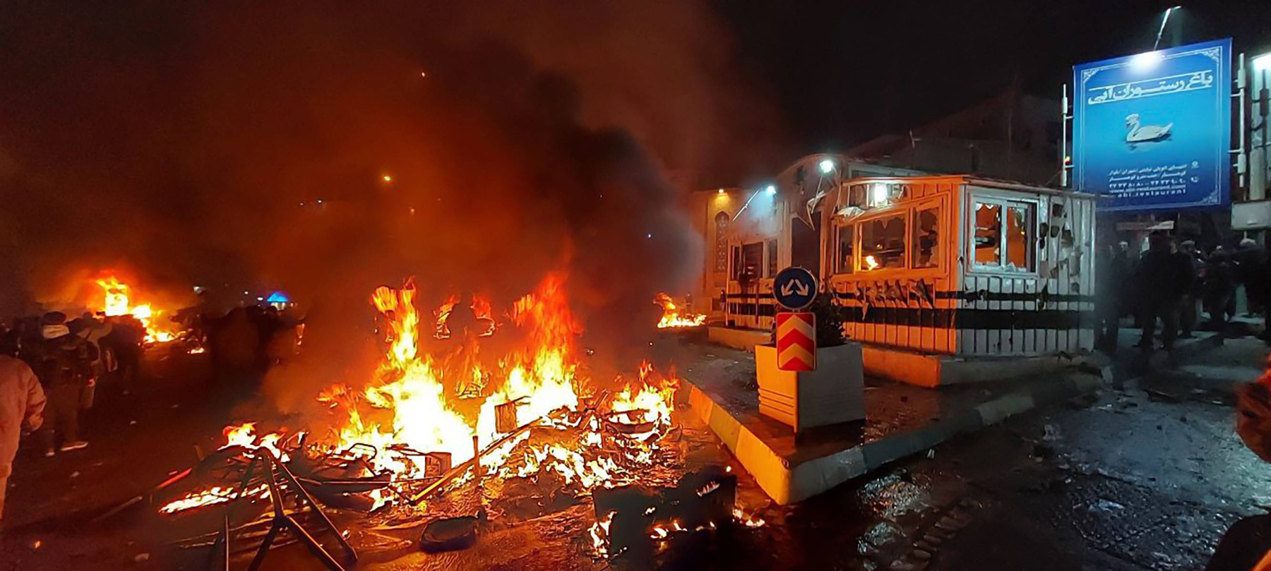Tehran (Saadat Abad), Iran, 08/01/2026 Ð Iranian regime police post burn on a street