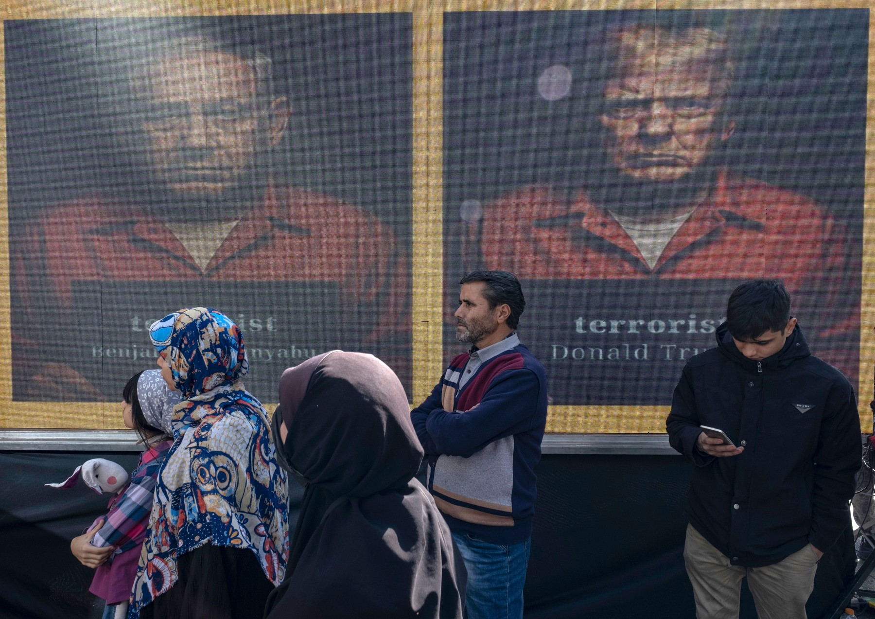 Iranian protesters  portraits of the U.S. President, Donald Trump, and Benjamin Netanyahu,  anti-U.S. and anti-Israeli rally marking the anniversary of the U.S. embassy occupation in downtown Tehran, Iran, on November 4, 2025.