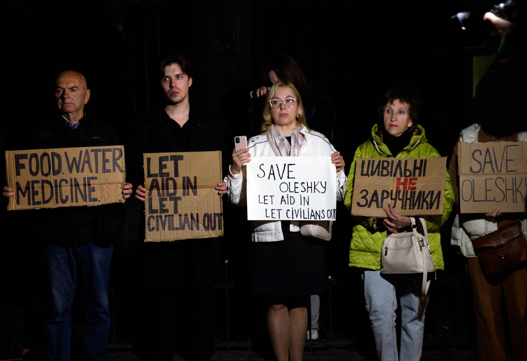 October 6, 2026, Kyiv, Ukraine: Activists hold placards with slogans during a rally in support of residents of Oleshky, Kherson region