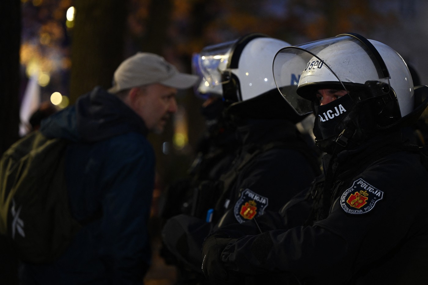 WARSAW, POLAND - OCTOBER 31: Polish riot police officers (Policja) stand in a defensive cordon along Avenue Szucha outside the Constitutional Tribunal (Trybunał Konstytucyjny)