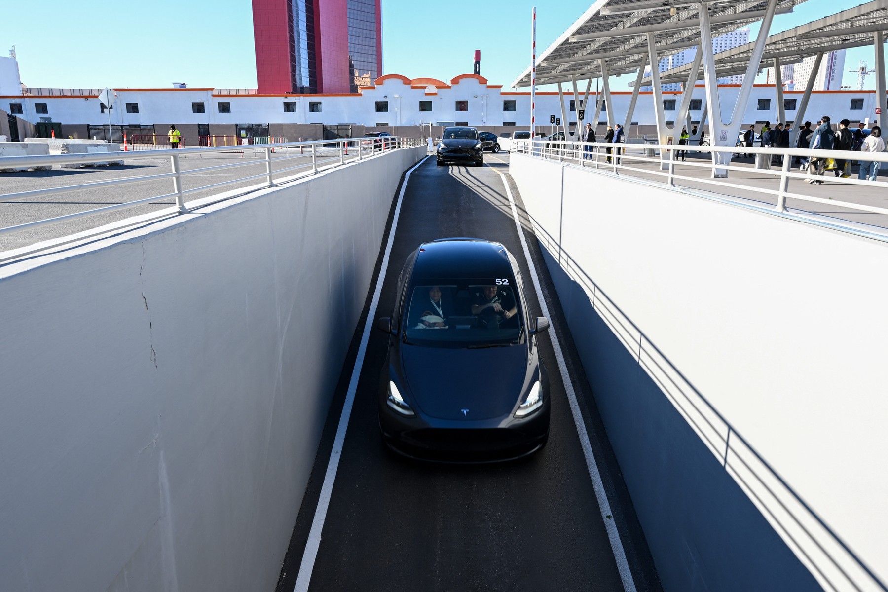 LAS VEGAS, NEVADA - JANUARY 11: Visitors take rides between North Hall and West Hall
