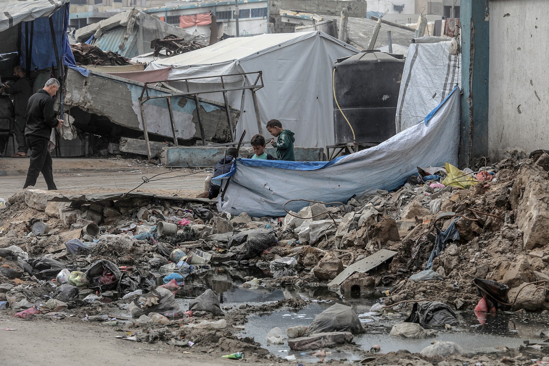 KHAN YUNIS, GAZA - FEBRUARY 17: A view of piles of garbage as displaced Palestinians struggle to survive