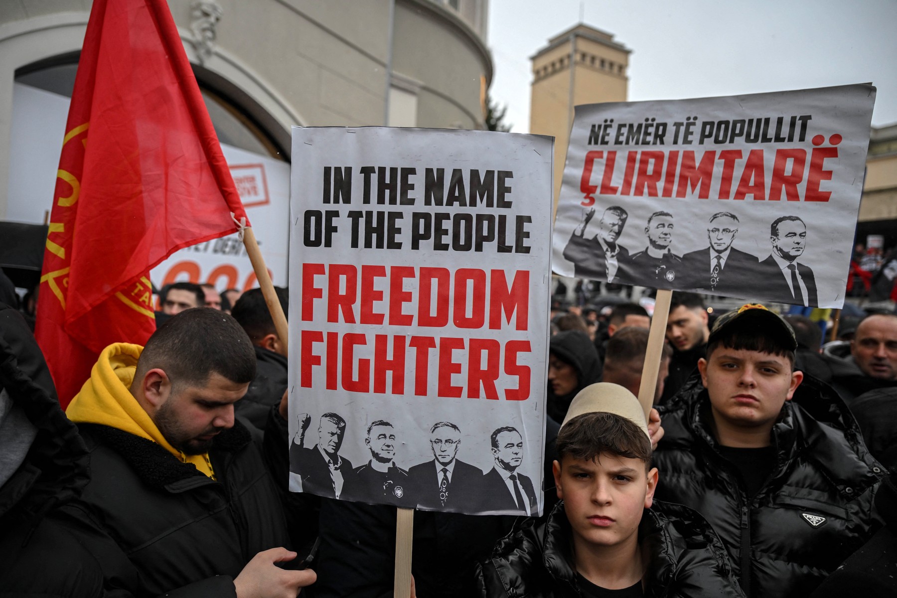 Kosovo Albanians demonstrate with placards in support of former Kosovo Liberation Army (KLA)