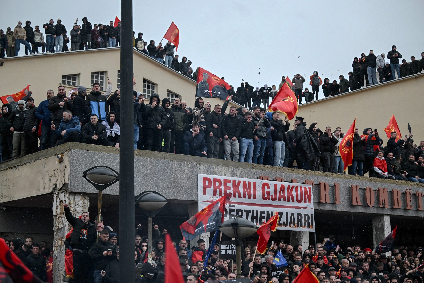 Kosovo Albanians demonstrate with KLA flags in support of former Kosovo Liberation Army