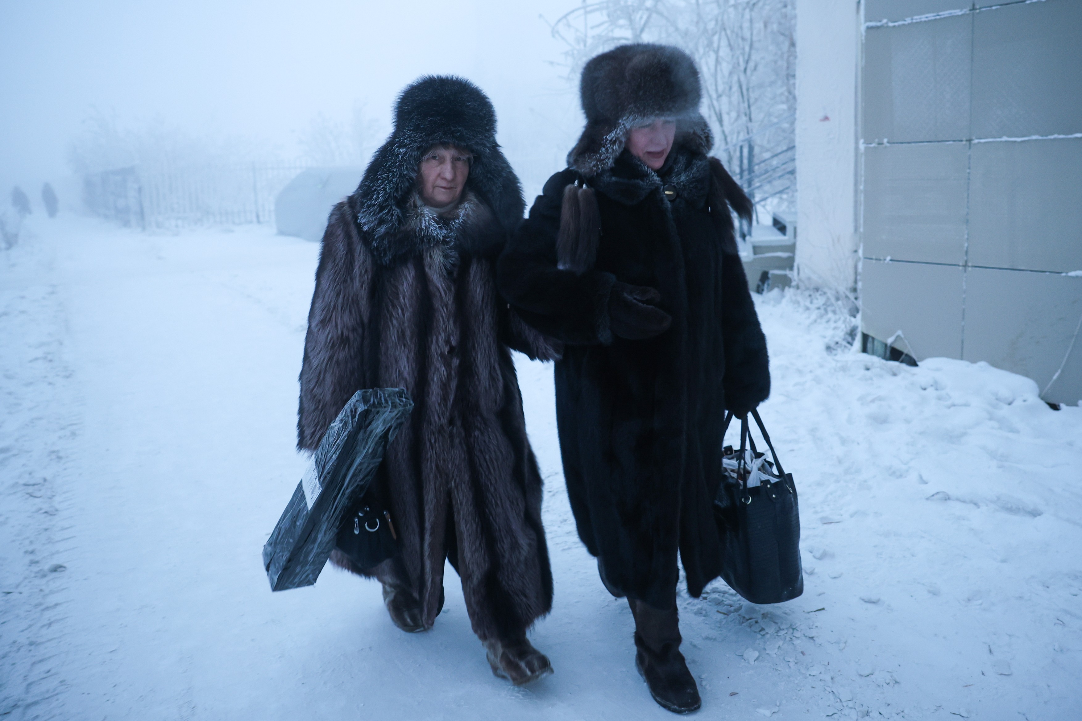 RUSSIA, YAKUTSK - JANUARY 12, 2026: People walk in a street,Image: 1065384169, License: Rights-managed, Restrictions: * Switzerland And Russia Rights Out *, Model Release: no