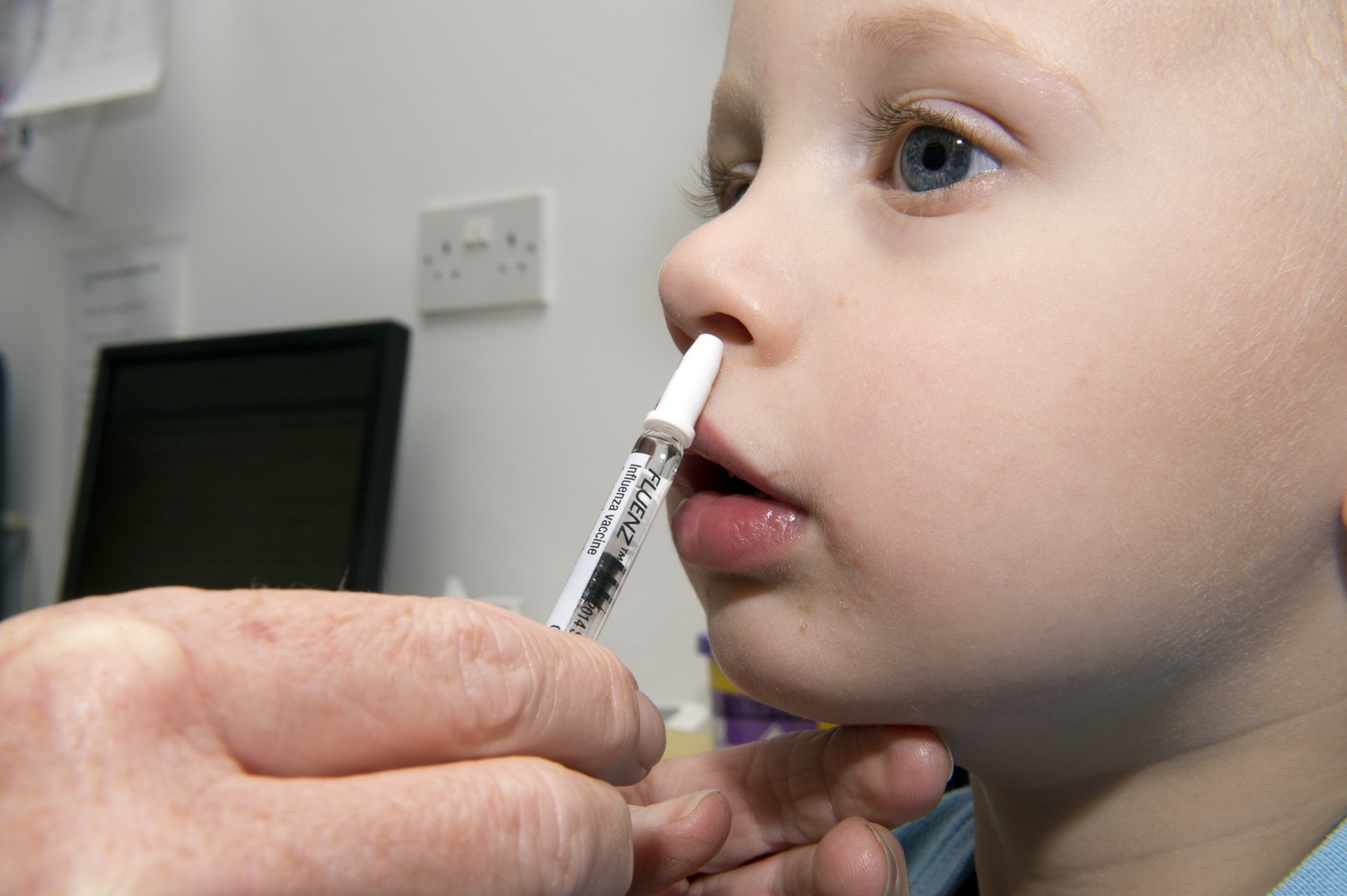 Seasonal flu vaccine. Close-up of a toddler receiving the 2013/2014 seasonal influenza