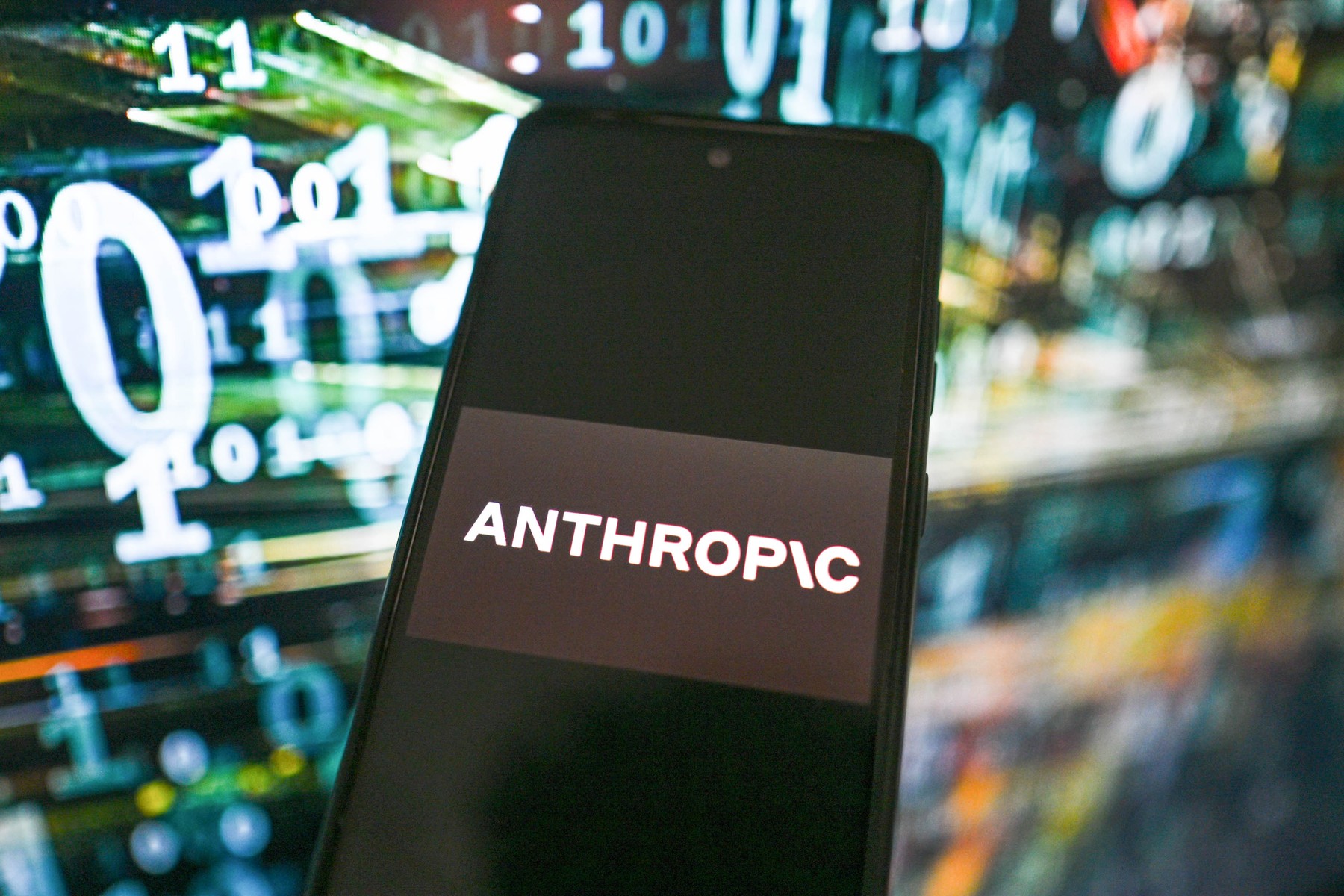 March 3, 2026, Poland: In this photo illustration, an Anthropic logo is seen displayed on a smartphone with stock market percentages on the background.,Image: 1079860664, License: Rights-managed, Restrictions: , Model Release: no