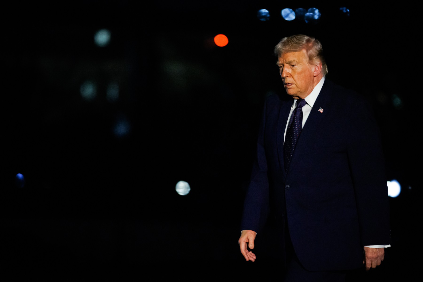 United States President Donald J Trump walks on the South Lawn of the White House