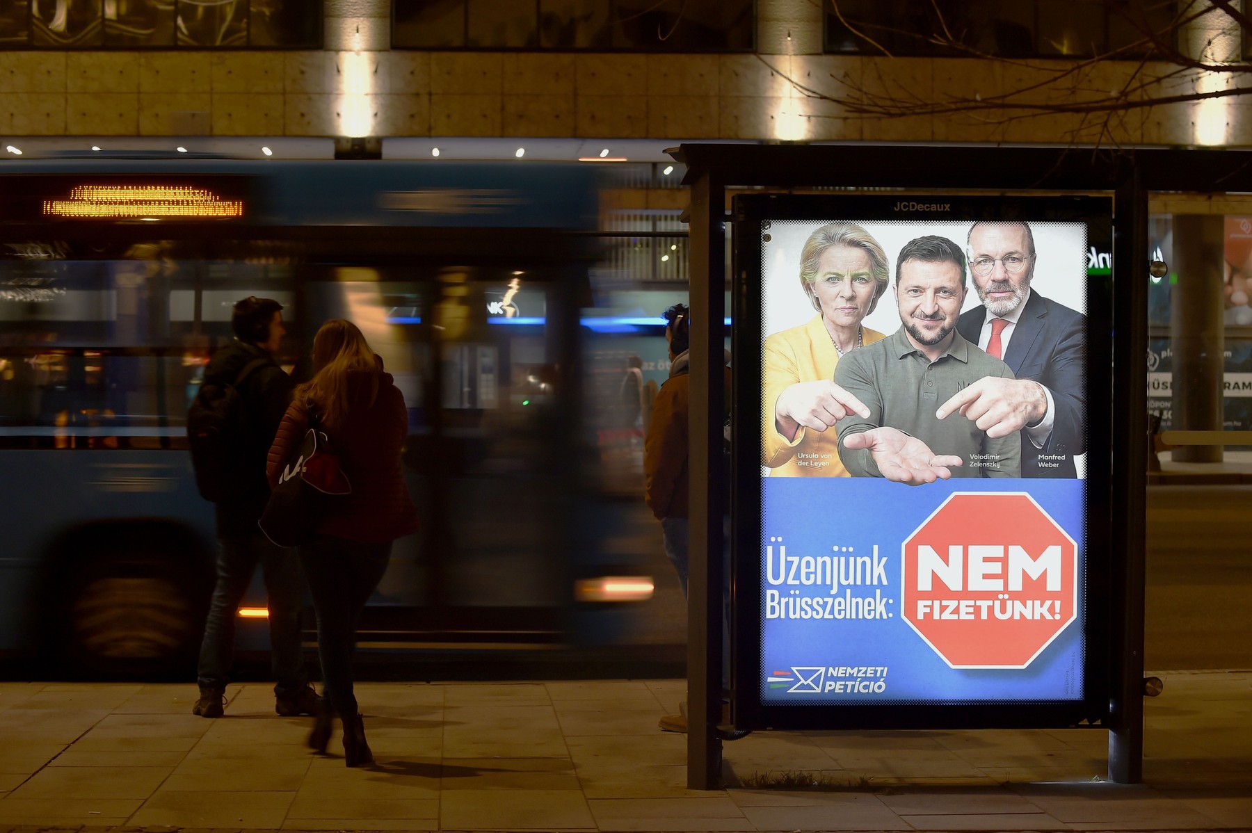 Ursula Von Der Leyen (L), Volodymyr Zelenskyy (C), and Manfred Weber (R) 'Message to Brussels: We are not paying'' in Budapest