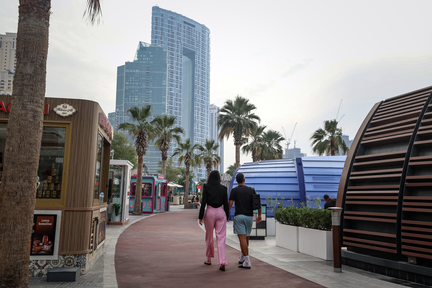 A couple walks along JBR beach in Dubai on March 10, 2026