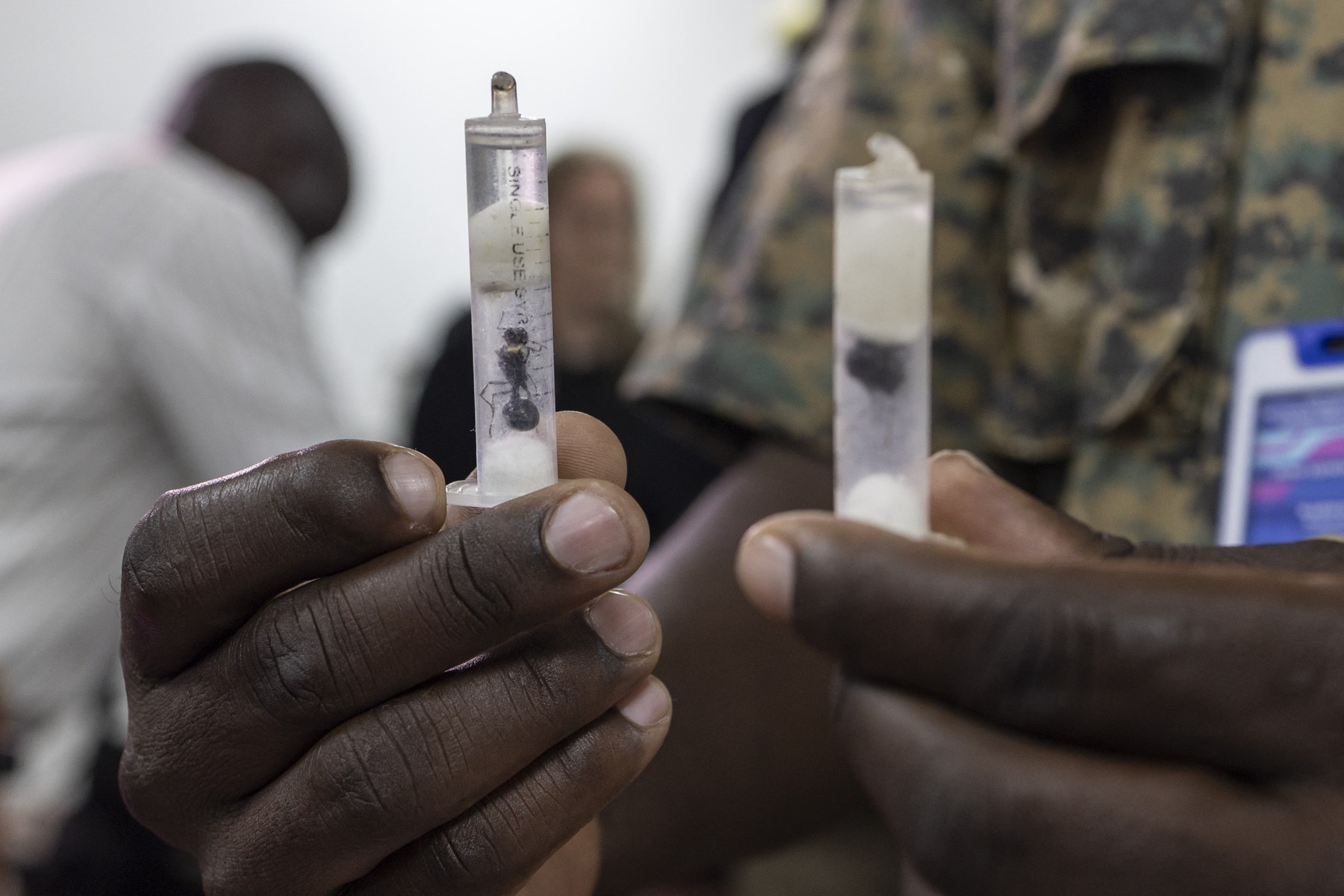 A Kenya Wildlife Services (KWS)warden displays some of the syringe cartridges modified to carry live ants at the Jomo Kenyatta International Airport law courts in Nairobi on March 17, 2026.