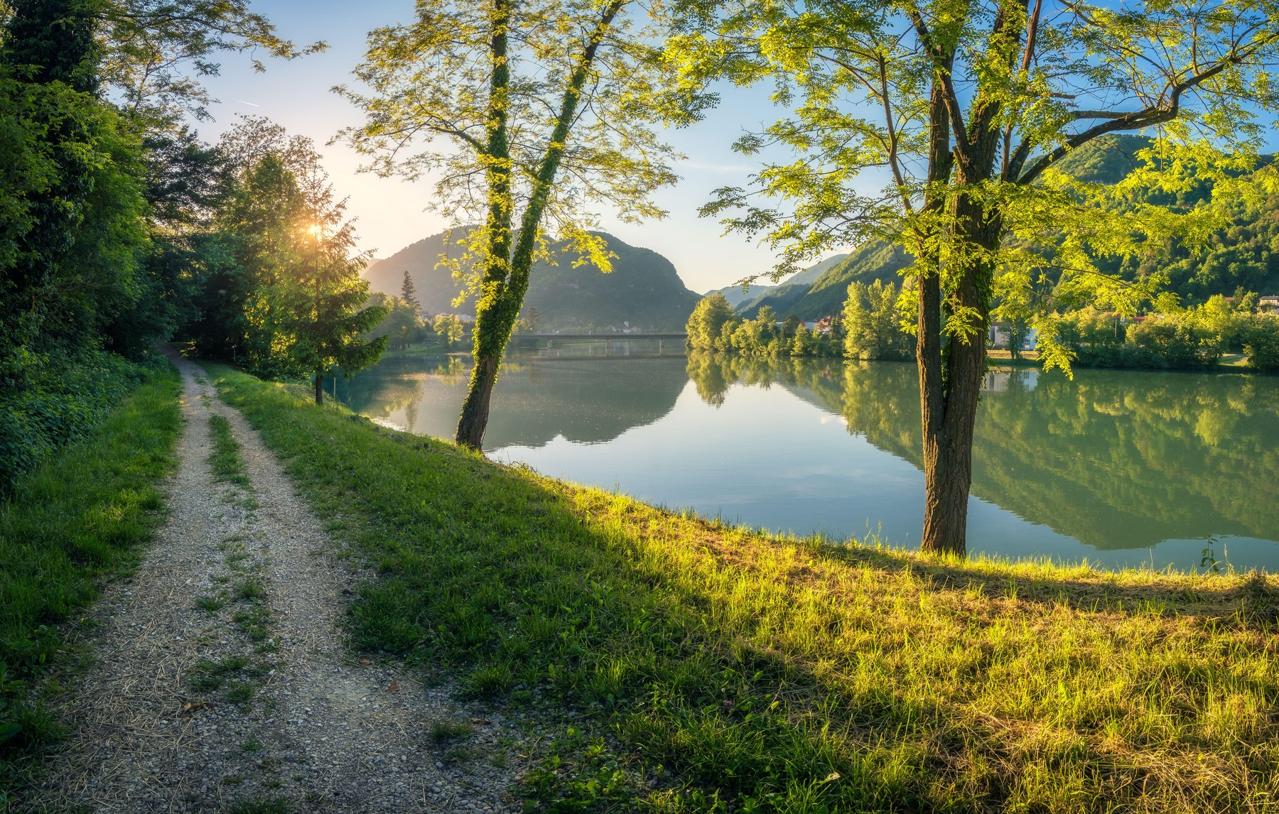 Sunlight  beautiful scene over the calm Sava River in Slovenia