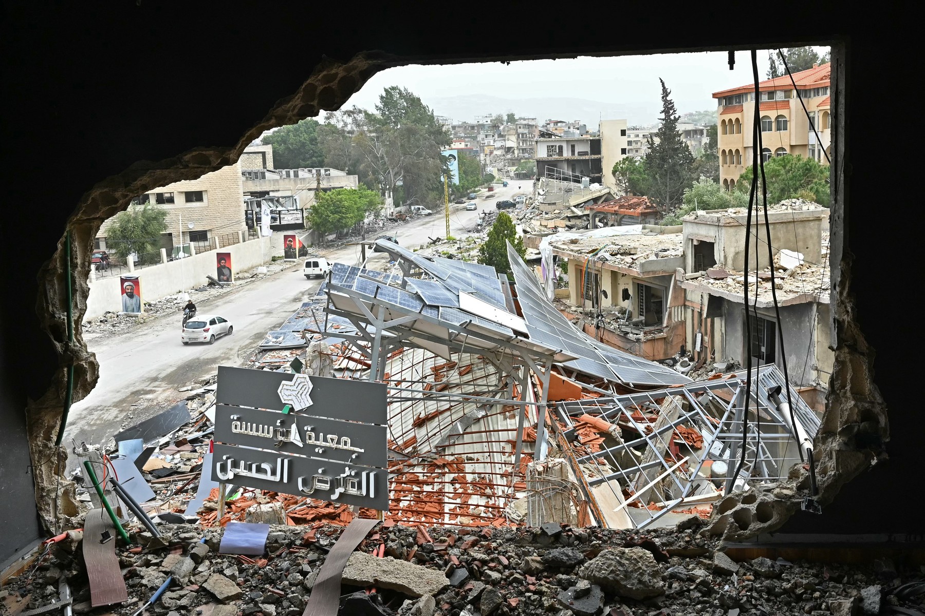 Displaced residents drive past destroyed buildings as they return back to the southern Lebanese city of Nabatieh on April 18, 2026. Lebanese President Joseph Aoun said on April 17