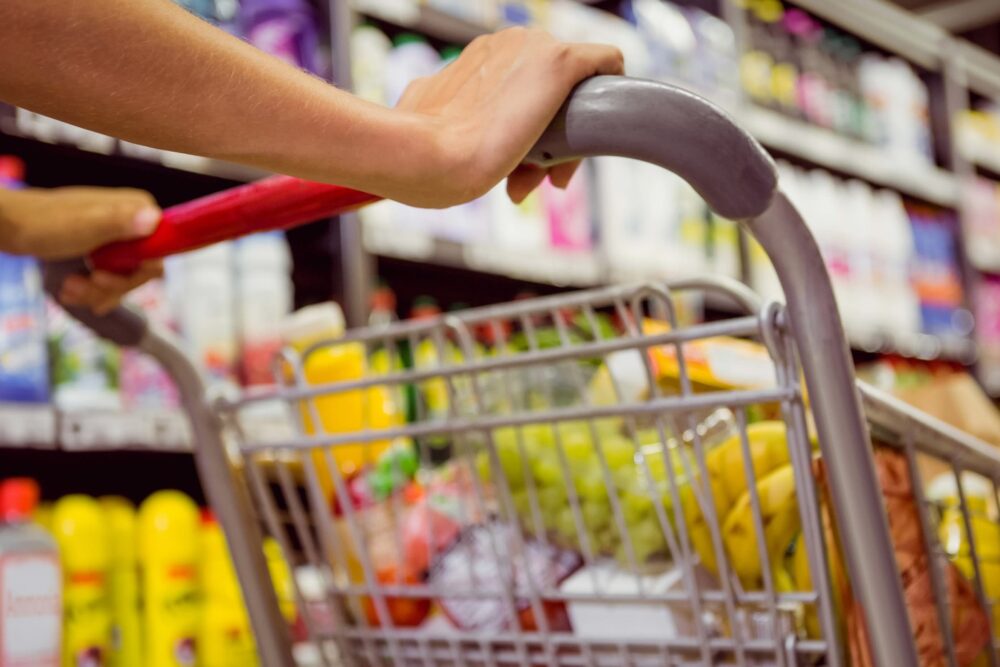 Hands of caucasian female holding shopping cart in food market. shopping, trade and lifestyle concept.,Image: 749575001, License: Royalty-free, Restrictions: , Model Release: no