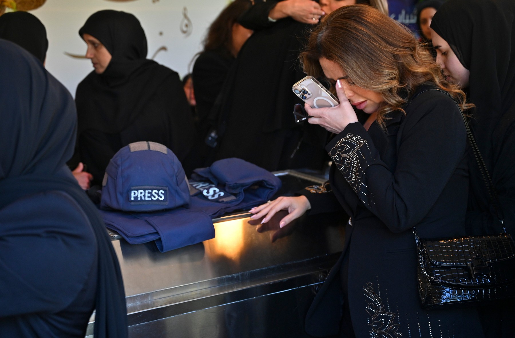 People attend a funeral ceremony for journalist Amal Khalil, who was killed in an Israeli military operation targeting the village of Tayri, in Nabatieh, Lebanon
