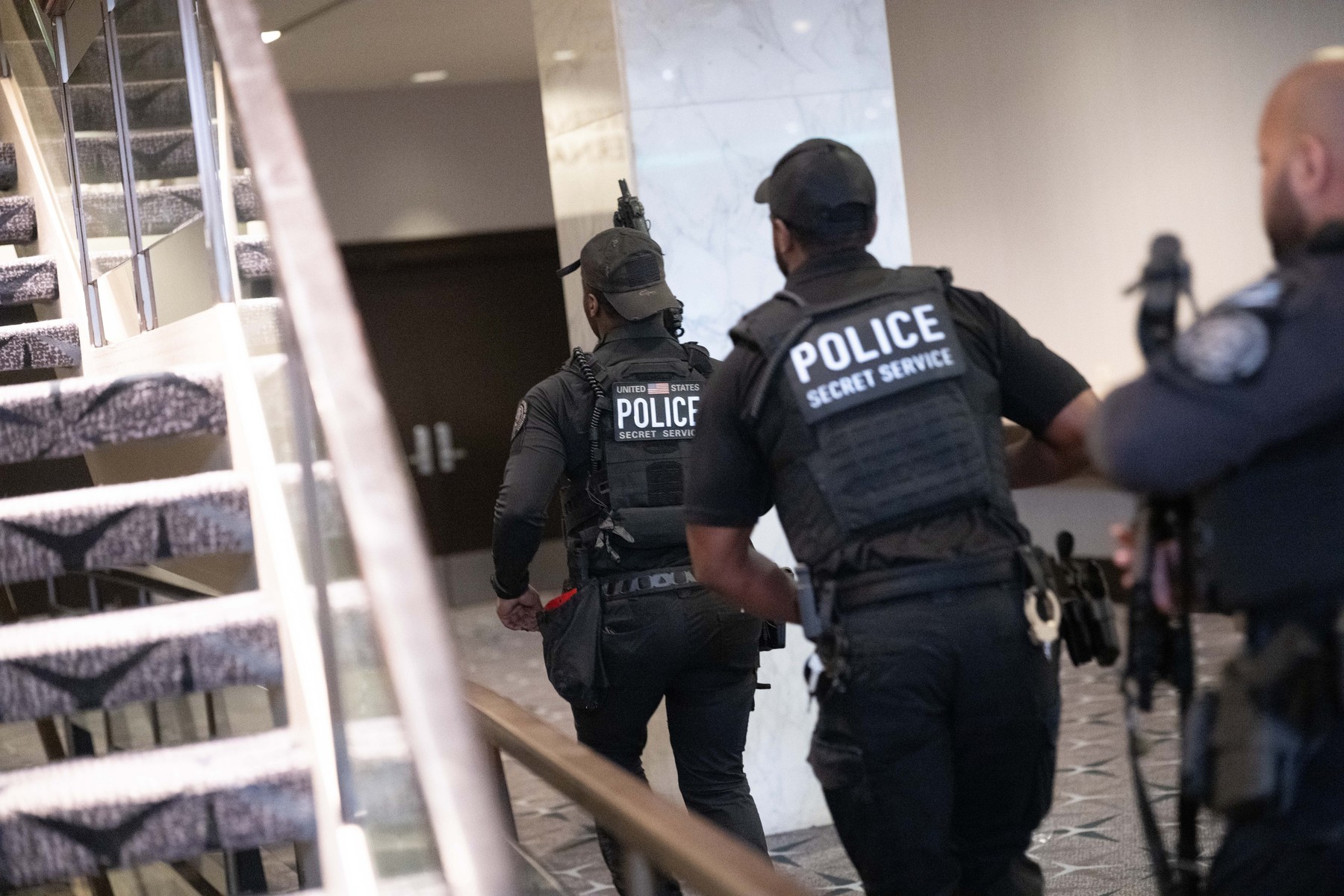 Secret Service agents rush to secure a scene in the Washington Hilton