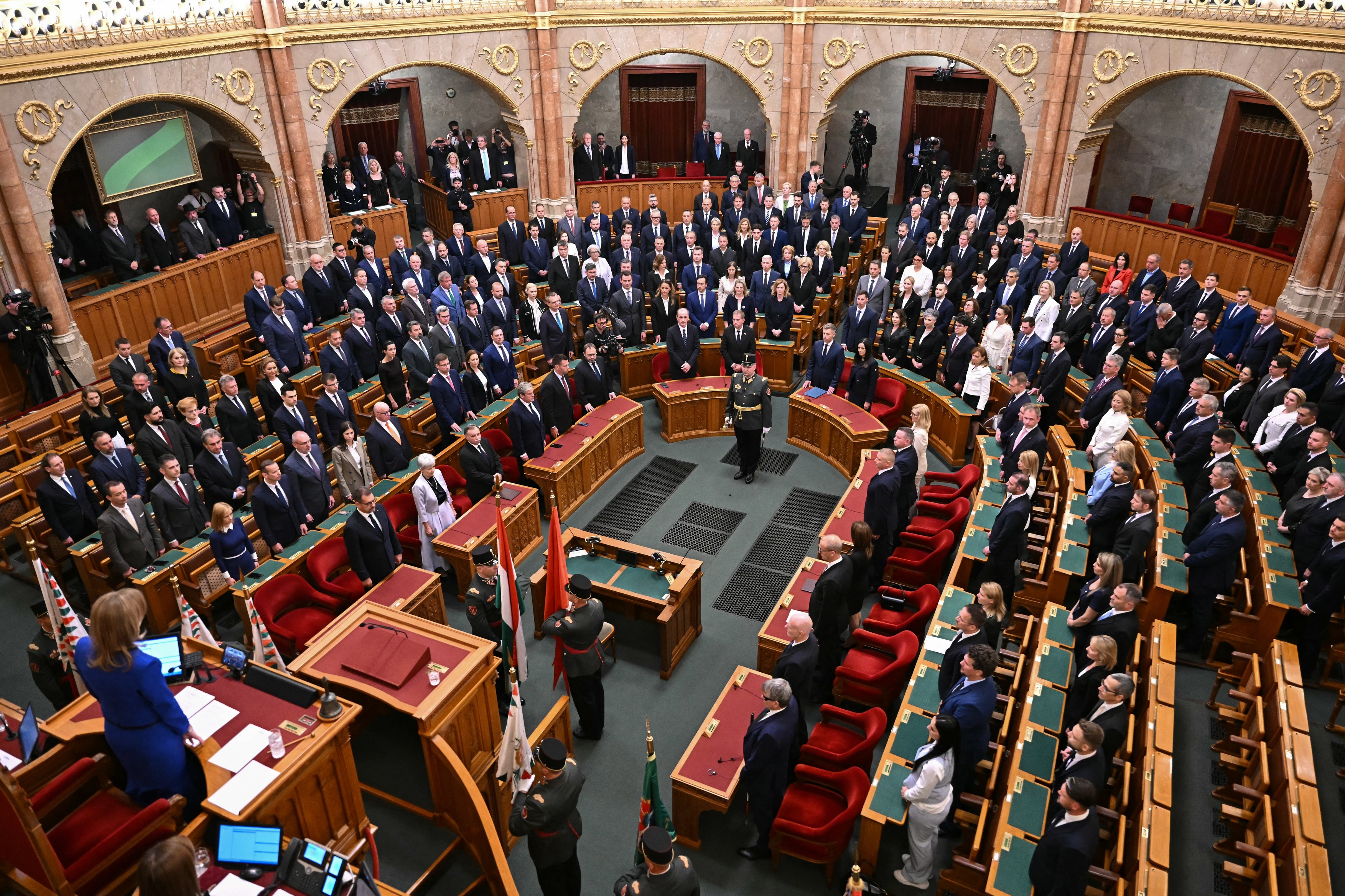 Hungary's new Prime Minister Peter Magyar (C-R) stands during the swearing-in ceremony for the new cabinet ministers at the Hungarian Parliament in Budapest on May 12, 2026.,Image: 1098321053, License: Rights-managed, Restrictions: , Model Release: no