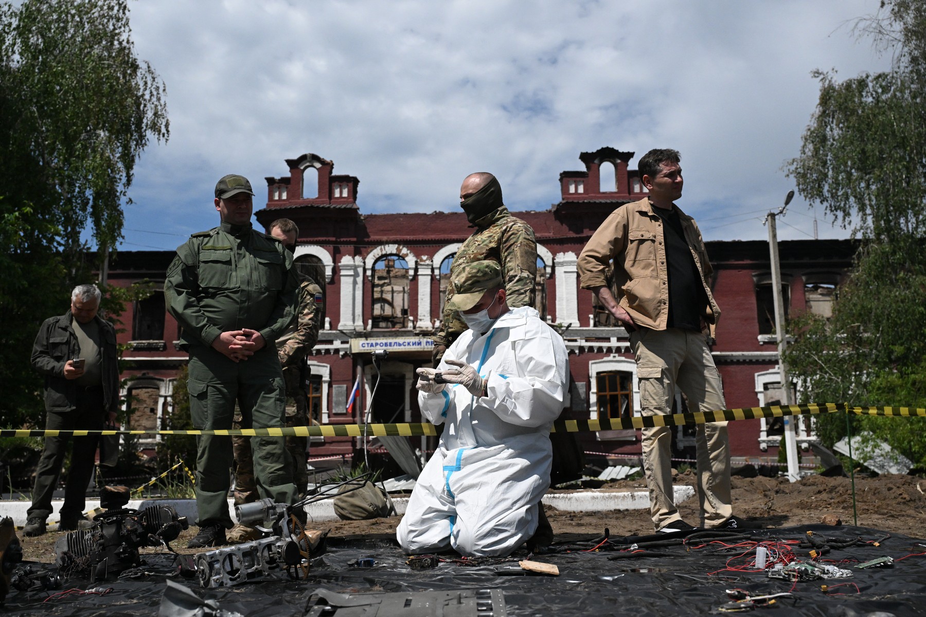 A Russian investigator examines parts of Ukrainian drones destroyed Starobilsk professional college of the Luhansk Pedagogical University,