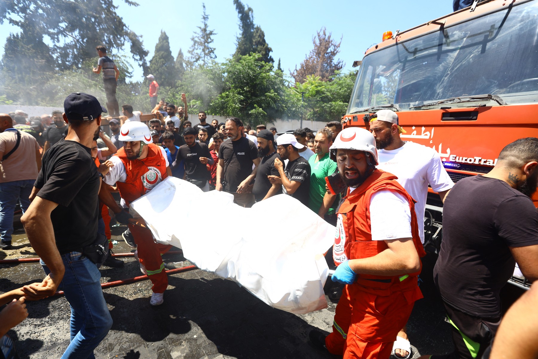SIDON, LEBANON - JUNE 10: Civil defense personnel carry a casualty following an Israeli airstrike that targeted a vehicle in the city of Sidon, Lebanon on June 10, 2026.
