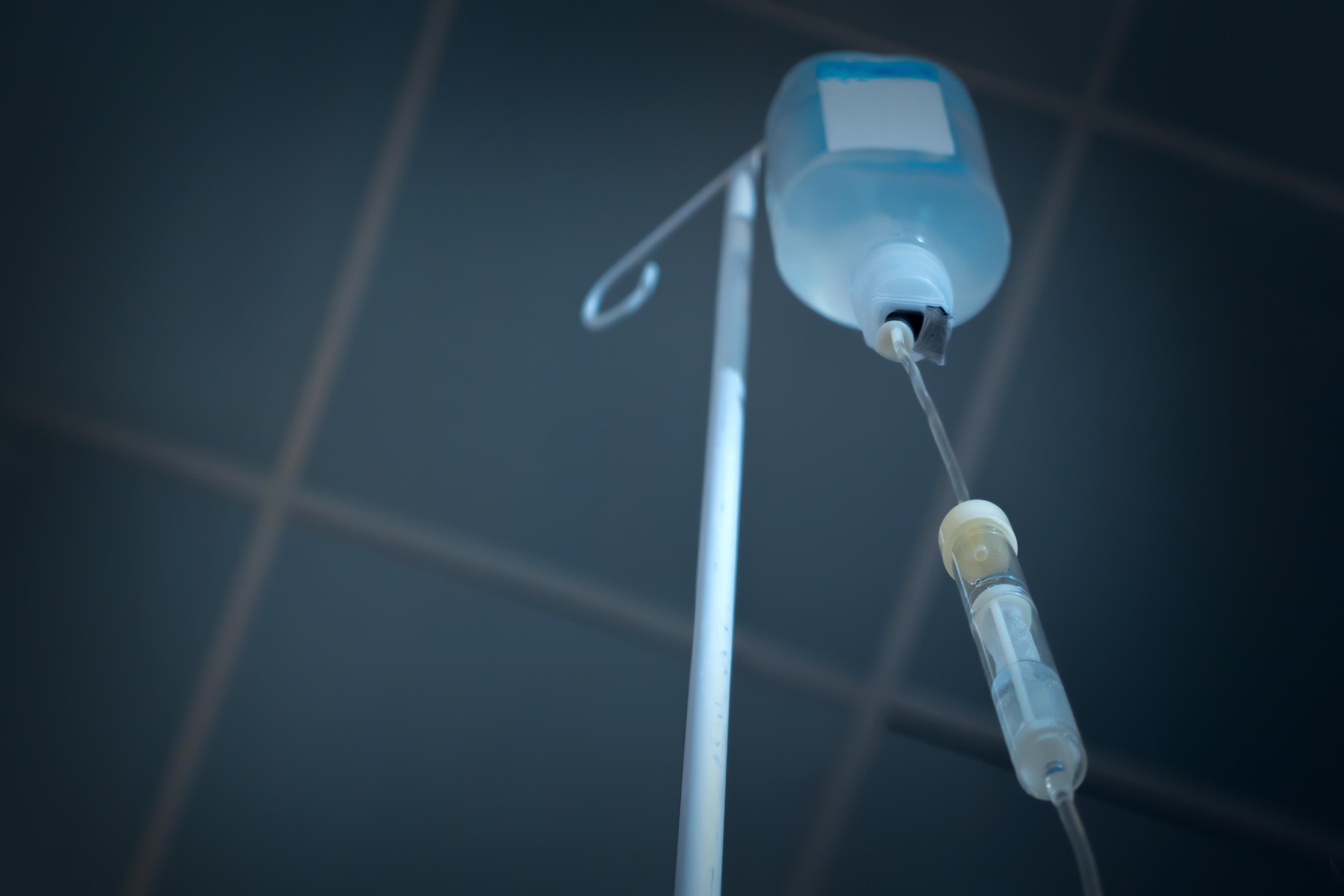 Infusion drip, drop counter in hospital background