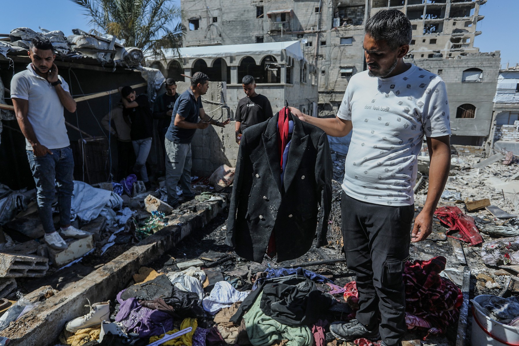 KHAN YUNIS, GAZA, PALESTINE - JUNE 6: Personal belongings, including a groom's suit, are seen among the rubble after an Israeli airstrike targeted central Khan Yunis in the southern Gaza Strip, Palestine on June 6, 2026.