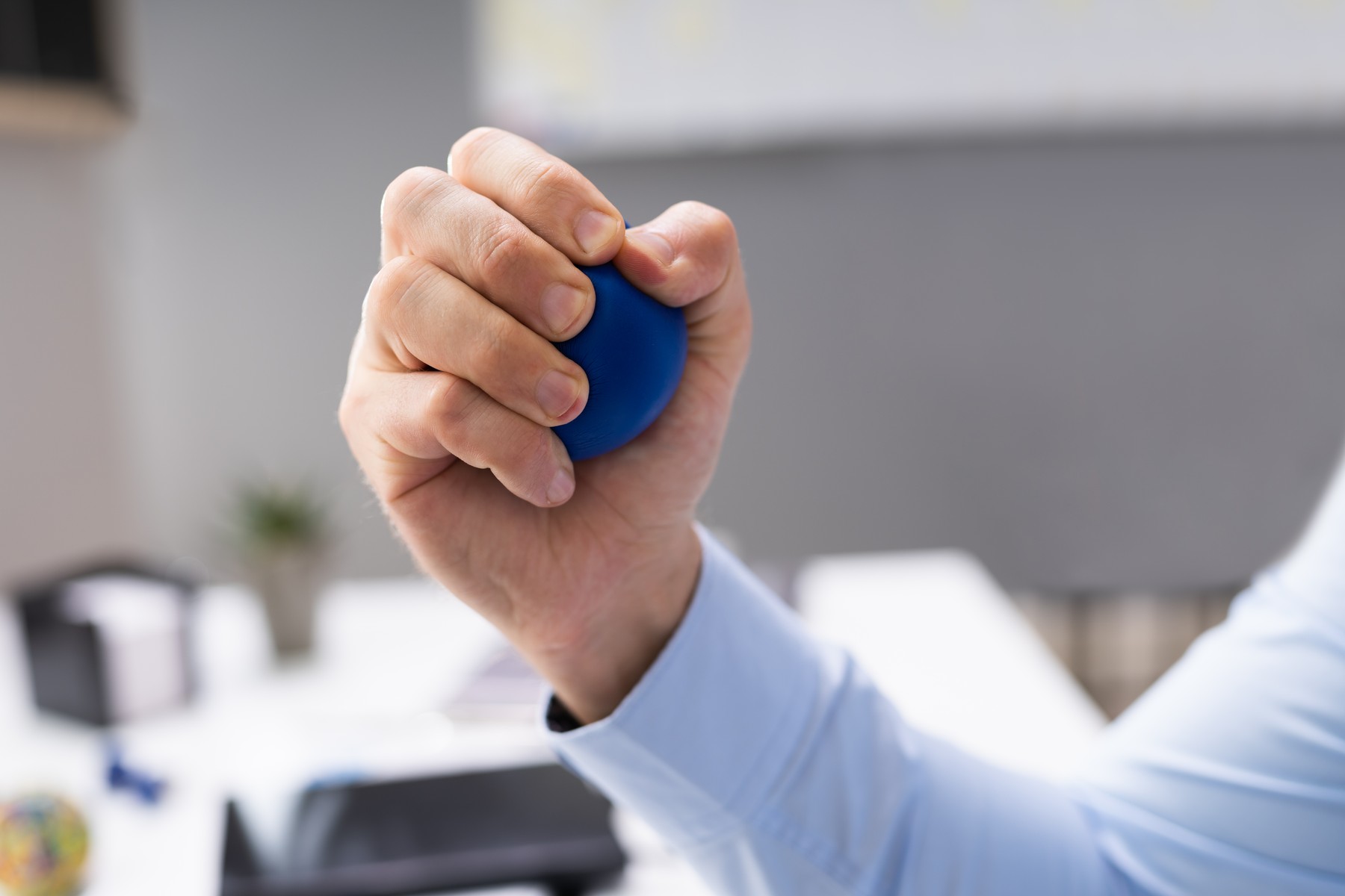 Close-up Of Person Hand Holding Blue Stressball,Image: 494077442, License: Royalty-free, Restrictions: , Model Release: no