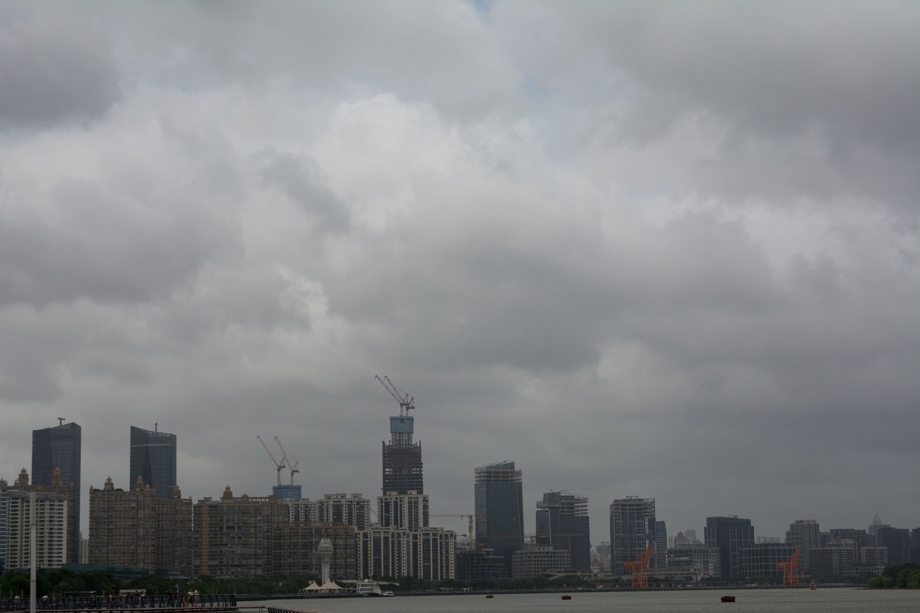 Heavy dark clouds are seen above the Huangpu River ahead of the arrival of Super Typhoon Bavi at West Bund, Shanghai, China, on July 11, 2026.