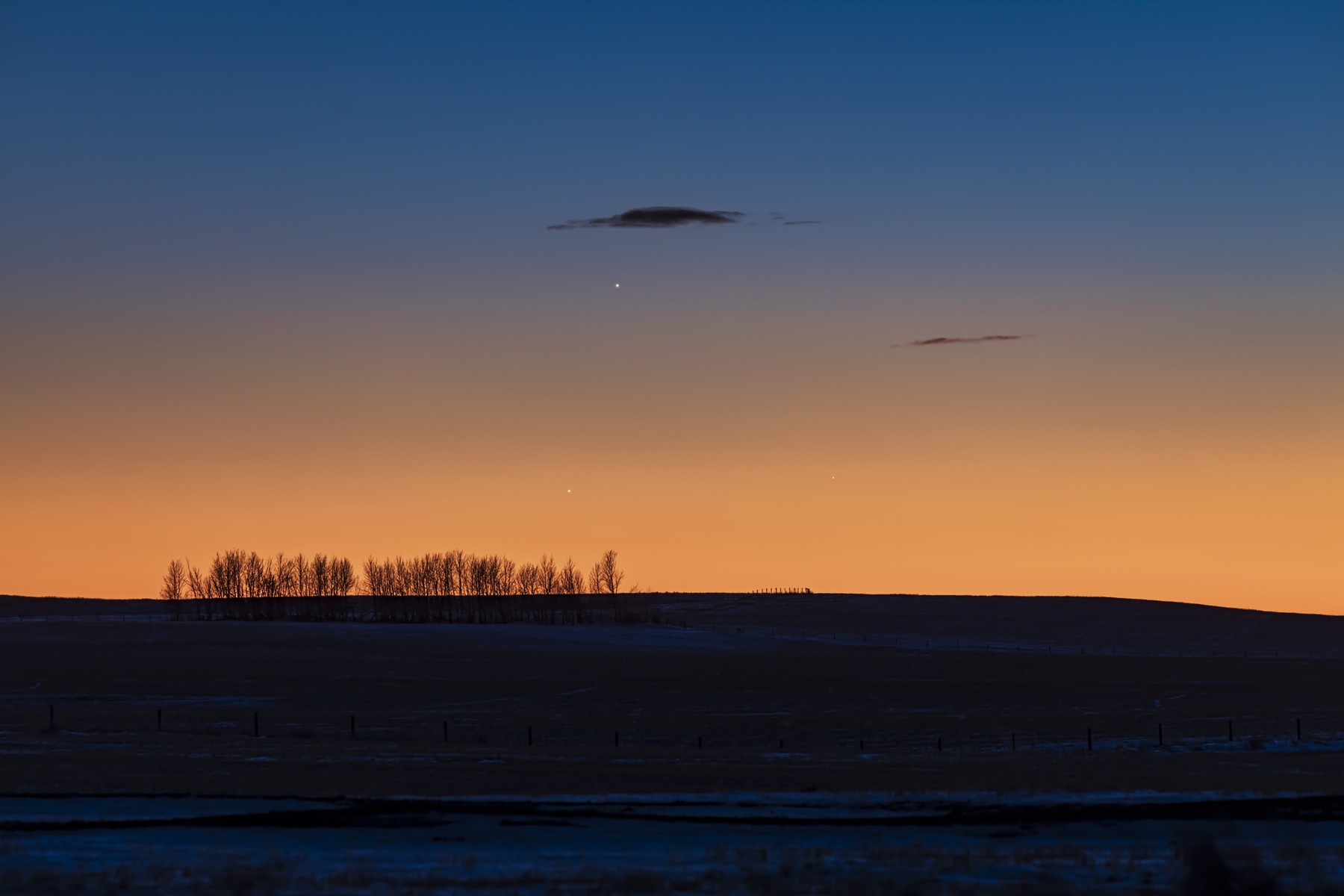Jupiter (highest and brightest), Saturn (lower right and dimmest), and Mercury (lower left) in the evening twilight on January 10, 2021. Taken from Alberta, Canada.,Image: 680468987, License: Rights-managed, Restrictions: , Model Release: no