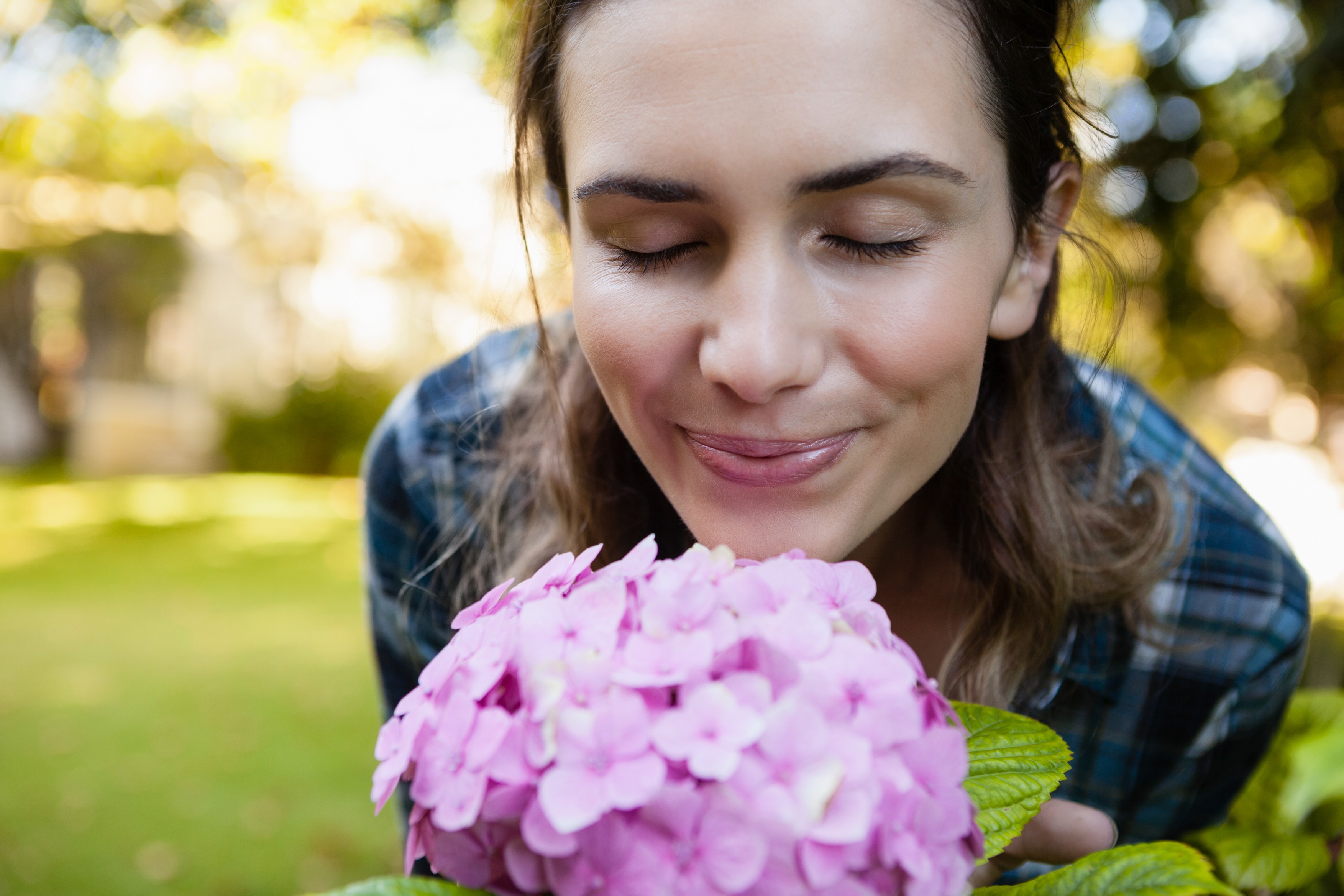 Close-up of woman with eyes closed smelling purple hydrangea flowers at backyard,Image: 341864870, License: Rights-managed, Restrictions: , Model Release: yes