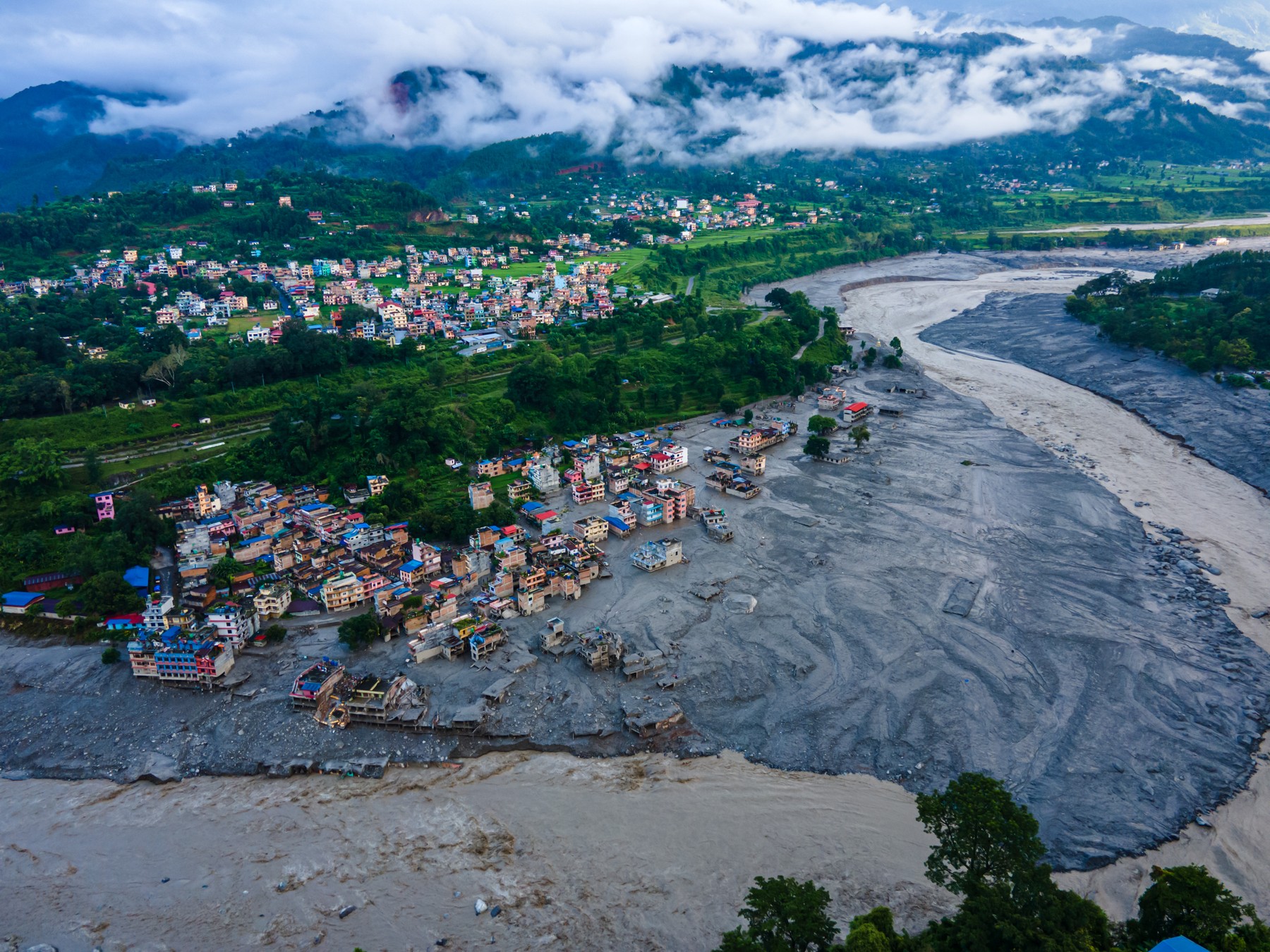An aerial view shows the aftermath of massive flooding along the Bhotekoshi