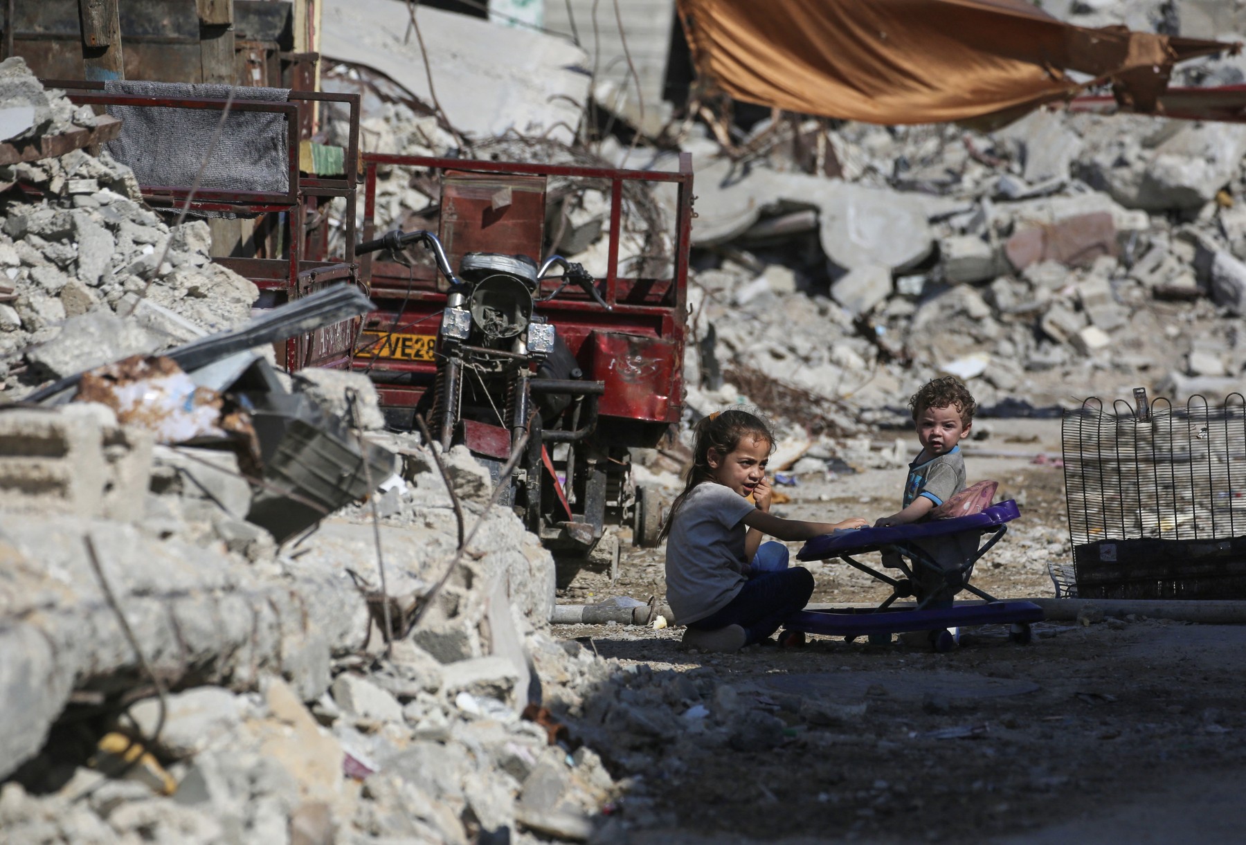 Palestinian children play amid the ruins of destroyed buildings in Khan Yunis  July 31, 2026,