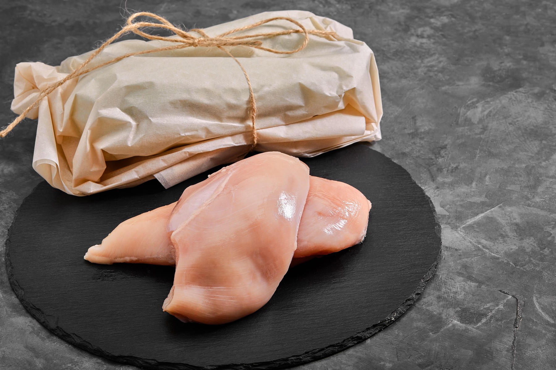 Chicken breasts, raw chicken fillet Photo for a store with natural products. Food delivery, gray background. copies of the space,Image: 548972506, License: Royalty-free, Restrictions: , Model Release: no