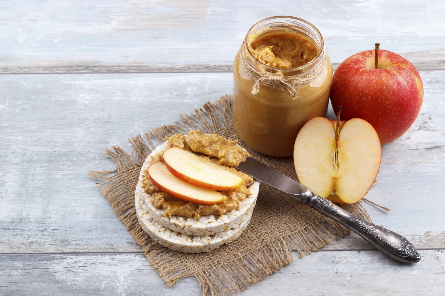 Breakfast with rice cakes, peanut butter and apple on old wooden background,Image: 1098833938, License: Royalty-free, Restrictions: , Model Release: no