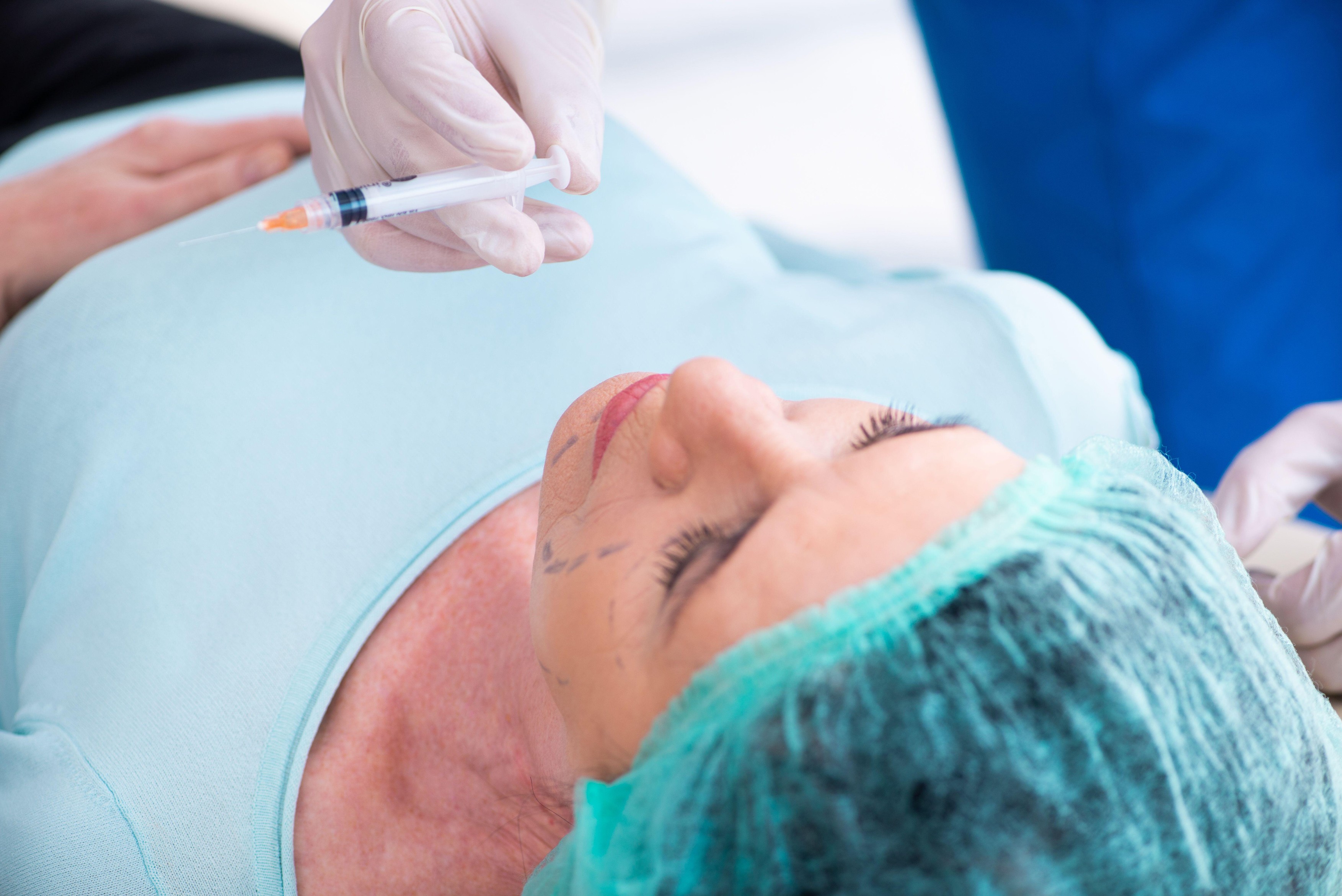 The old woman visiting male doctor for plastic surgery