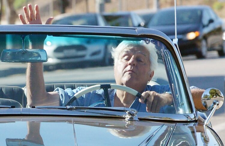 EXCLUSIVE: Jay Leno drives a rare 1955 Packard Caribbean convertible around L.A. with barely one eye open