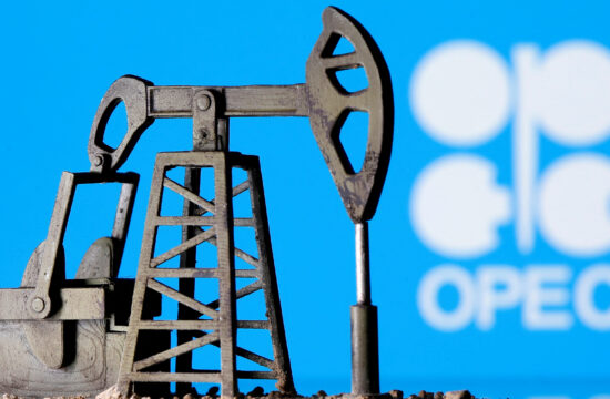 A 3D-printed oil pump jack is seen in front of displayed OPEC logo in this illustration picture
