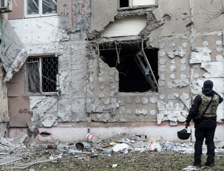 Ukrainian war crime prosecutor inspects a residential building damaged by a Russian military strike in Kherson